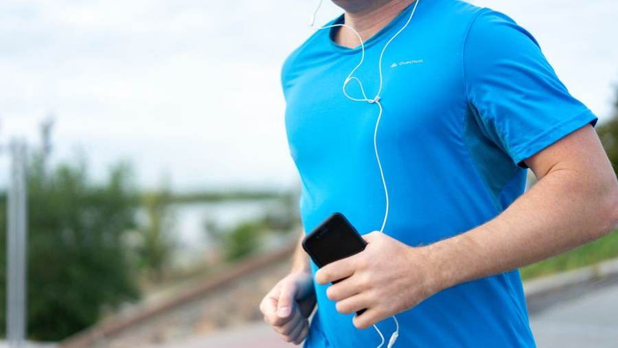 Runner holding a phone